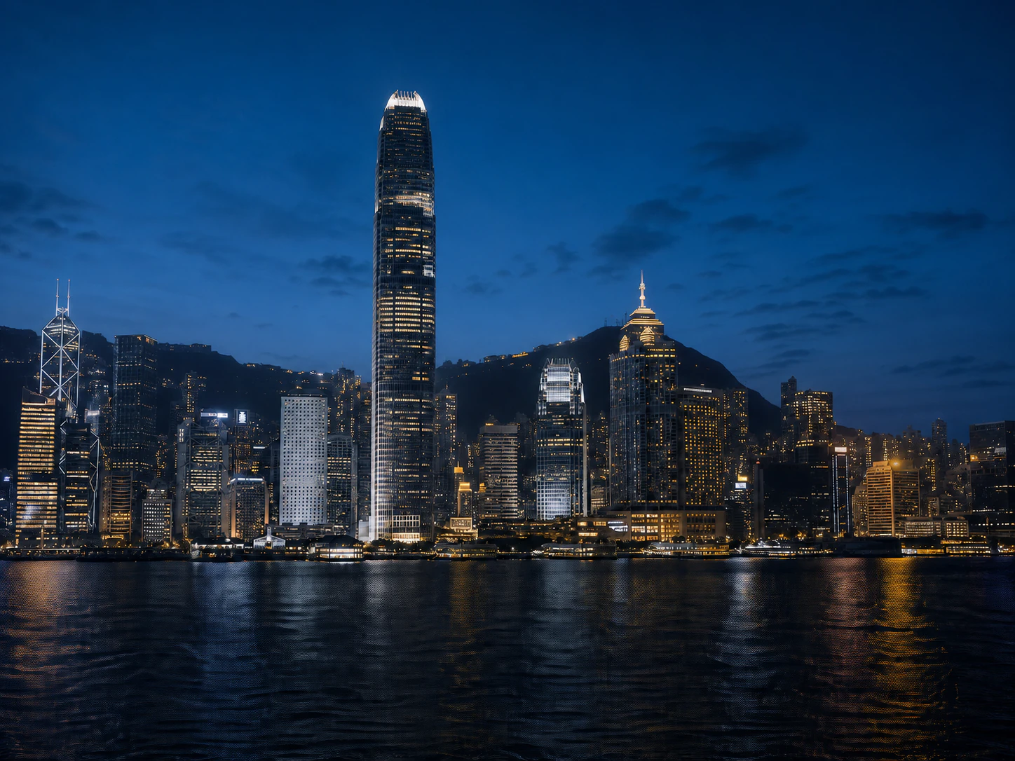 Victoria Harbour and the Hong Kong skyline at blue hour